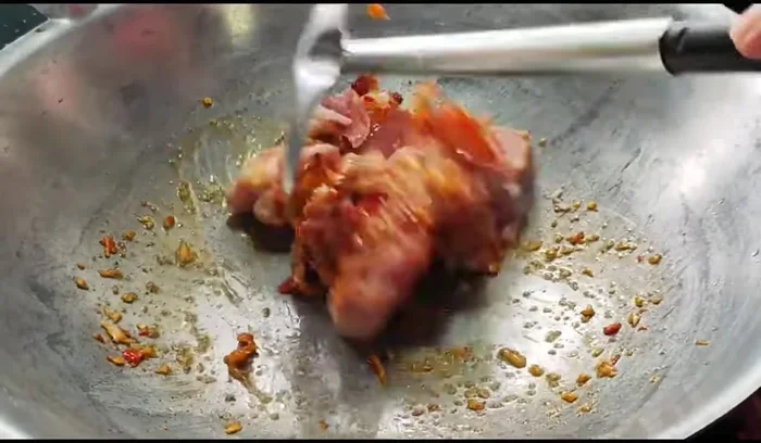 Add the pork and stir-fry until cooked.