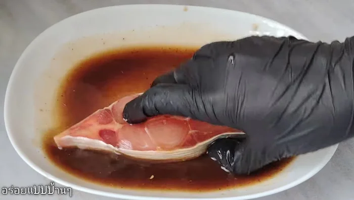 Add the catfish pieces to the marinade, ensuring each piece is coated. Marinate for 15-30 minutes, allowing the sauce to permeate the fish.