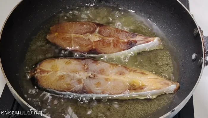 Heat oil in a pan. Once hot, carefully fry the sun-dried catfish on both sides until golden brown and cooked through.