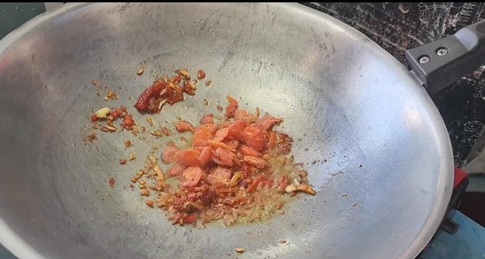 Add the dried shrimp and continue to stir-fry.