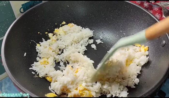 Add rice, sugar, salt, ground pepper, and seasoning sauce. Stir-fry until well combined.