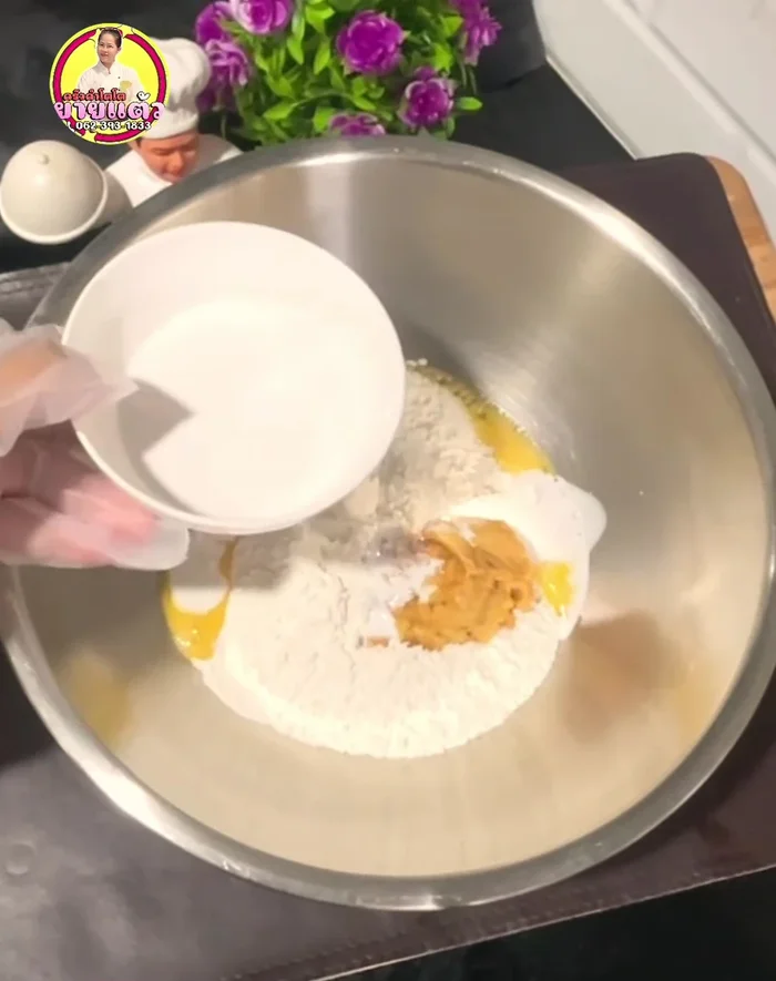 Gradually add half of the coconut milk, mixing until the sugar dissolves completely.