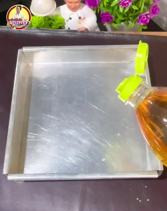 Grease an 8x8 inch, 2-inch deep pan. Pour the mixture into the prepared pan.