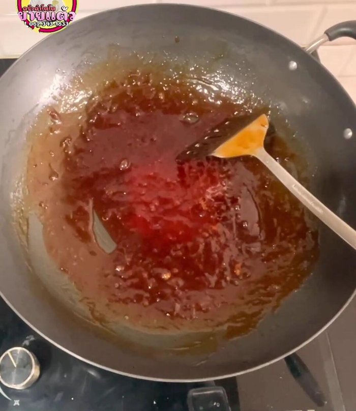 Add the fried noodles to the sauce over low heat. Mix gently to coat evenly, ensuring the noodles don't clump together.