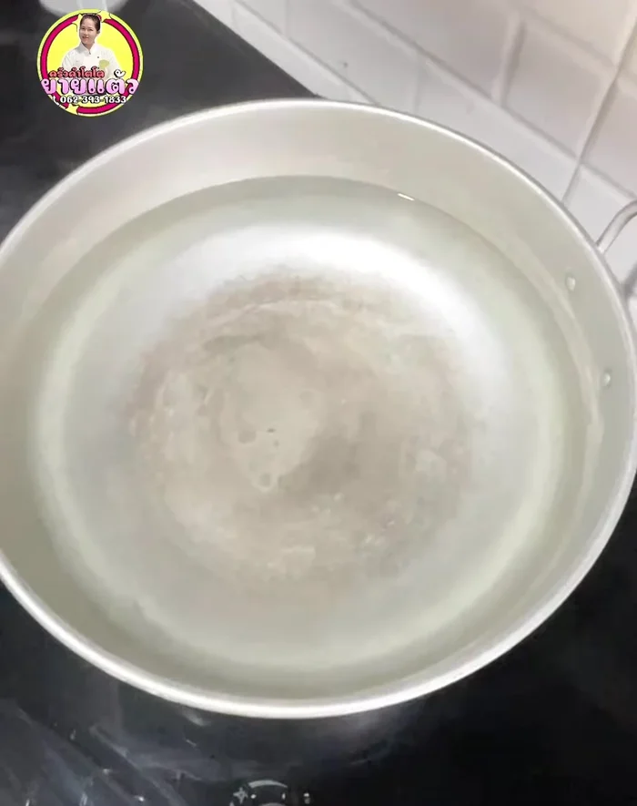 Pour the cooled water into bottles.