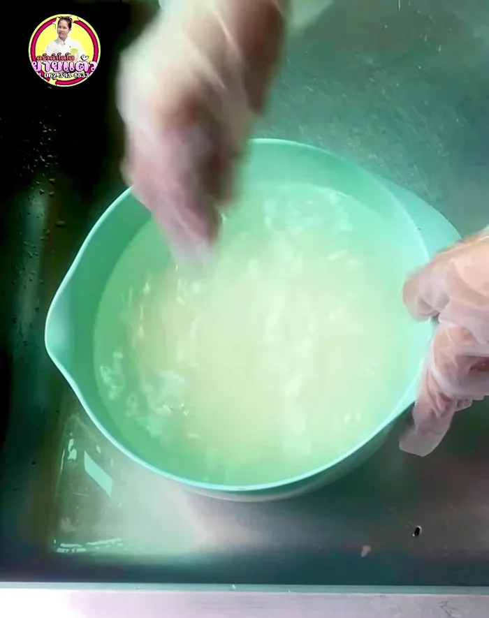 Drain soaked rice and rinse again. Prepare fried rice: mix sugar, coconut milk, and salt until sugar dissolves.