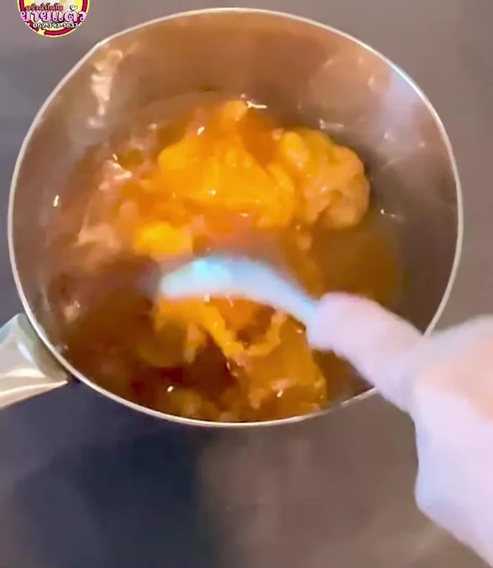 Heat the mixture over medium heat. Do not stir. Be careful, as the sugar may splatter.