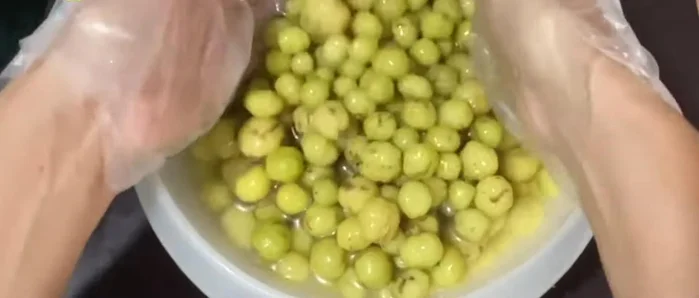 Drain the lime water from the star gooseberries. Do not rinse.