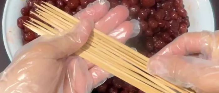 Prepare skewers. Cut meatball skewers in half. Thread the star gooseberries onto the skewers, leaving space between each.