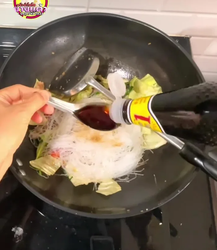 Reduce heat to low. Add the glass noodles, soy sauce, seasoning powder, oyster sauce, sugar, and sweet soy sauce. (99.64)