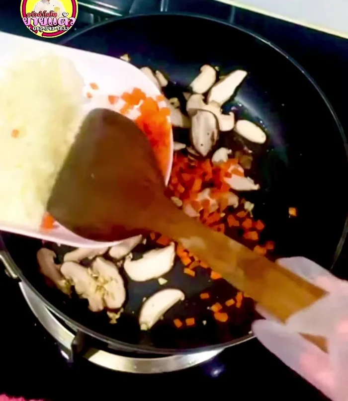 Add mushrooms, carrots, and stir-fry until fragrant.