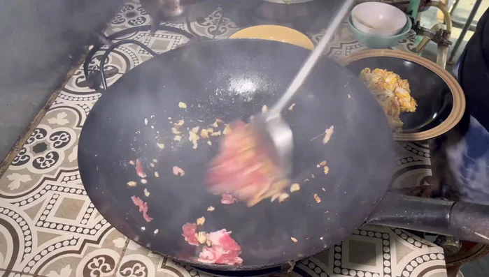 Add pork neck and stir-fry until cooked.