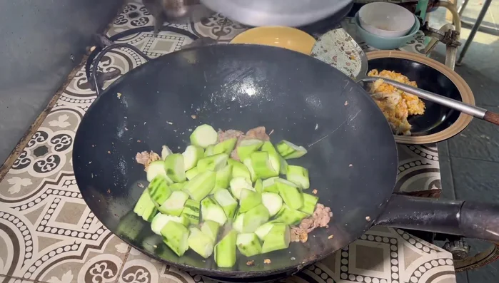 Add the squash and stir-fry with the pork.