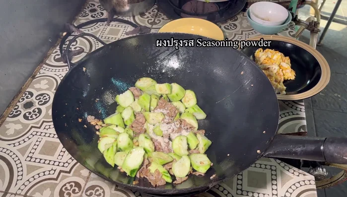 Season with seasoning powder, granulated sugar, oyster sauce, and soy sauce. Stir-fry to combine.
