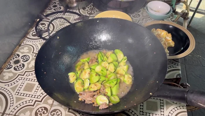 Add plain water, cover the pan, and let it simmer for about 2 minutes.