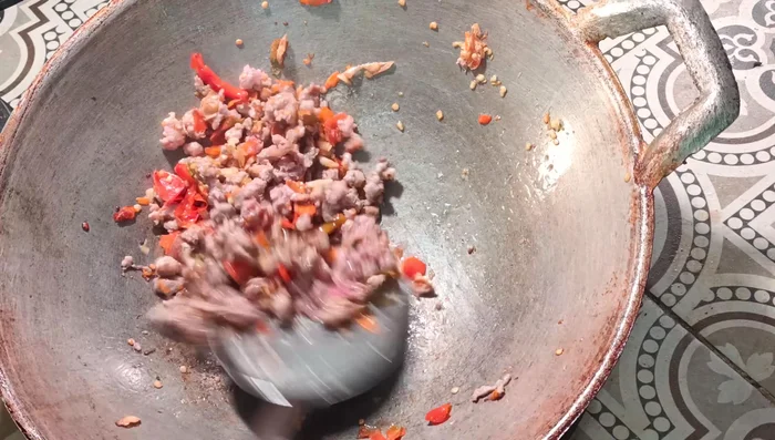 Add the minced pork and stir-fry until cooked through. Season with oyster sauce, fish sauce, seasoning sauce, sugar, and seasoning powder (optional). Add dark soy sauce for color.