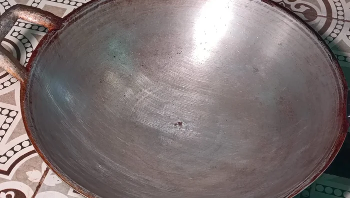 Put a pan on the stove and add oil.