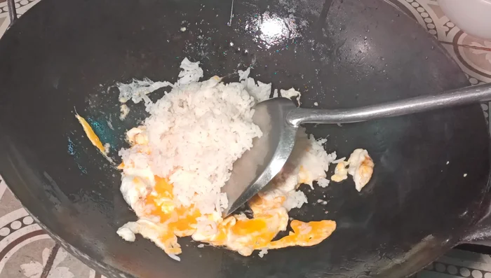 Add the cooked rice to the pan. Don't overcook the rice.