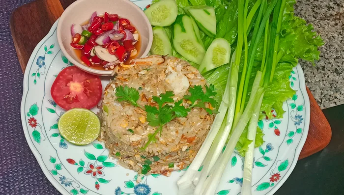 Serve the crab fried rice on a plate.