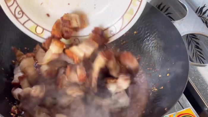 Add the crispy pork belly to the stir-fry and cook until heated through.