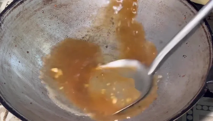 Simmer the sauce until it reaches desired thickness.