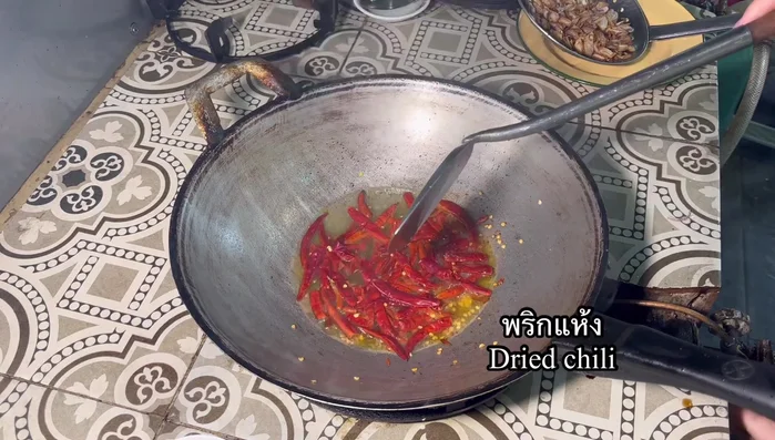 Fry the dried chilies briefly until fragrant.