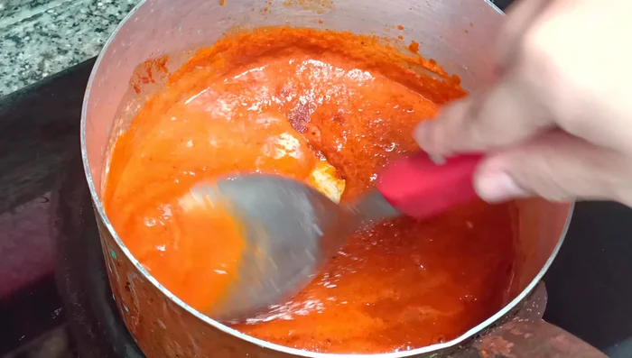 Add the peanut butter, coconut milk, fish sauce, palm sugar, and soy sauce. Simmer until the sauce has thickened.