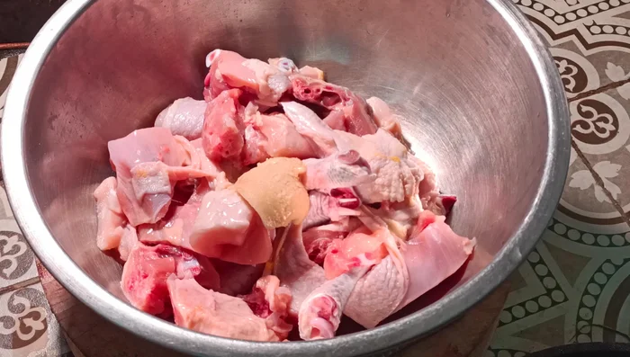 Marinate the chicken with water, coconut palm sugar, oyster sauce, seasoning sauce, salt, pepper, coriander root, galangal, garlic, shallots, lemongrass, kaffir lime leaves, and dried chili (optional).