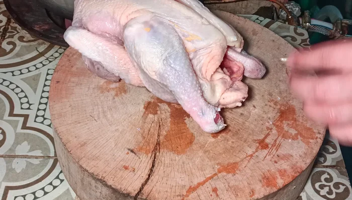 Chop the chicken, removing the nails, butt, and tail.