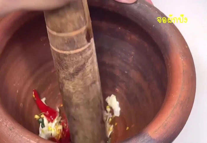 Season with fish sauce, palm sugar and lime juice. (Specifics are missing from the transcript)