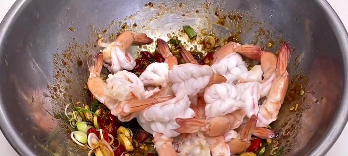 Continue cooking the prawns.