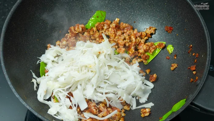 Add the boiled and drained pickled bamboo shoots to the pan.
