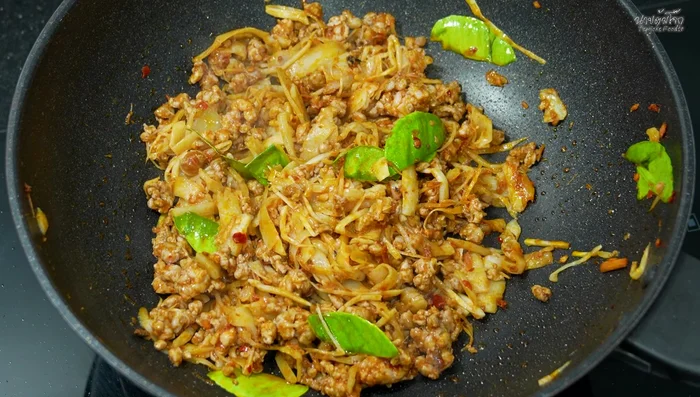 Stir-fry everything until well combined and the pork is cooked. Season with oyster sauce, fish sauce, and a little sugar. Add a small amount of clean water to help the seasonings blend.