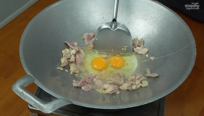 Add eggs and stir-fry until set. (215.28)