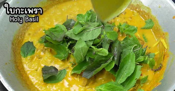 Add basil leaves and stir until wilted. Cook until all ingredients are thoroughly cooked.