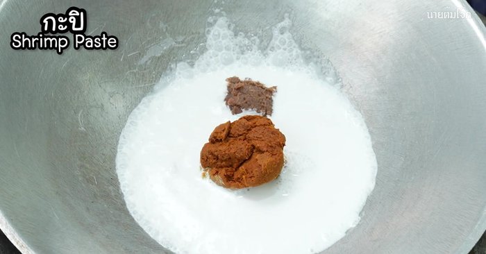 Add shrimp paste and stir-fry until it melts.