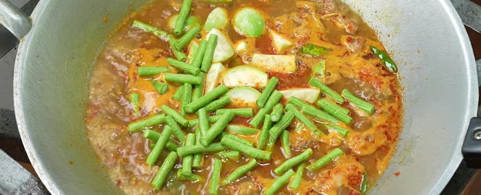 Add yardlong beans and baby corn.
