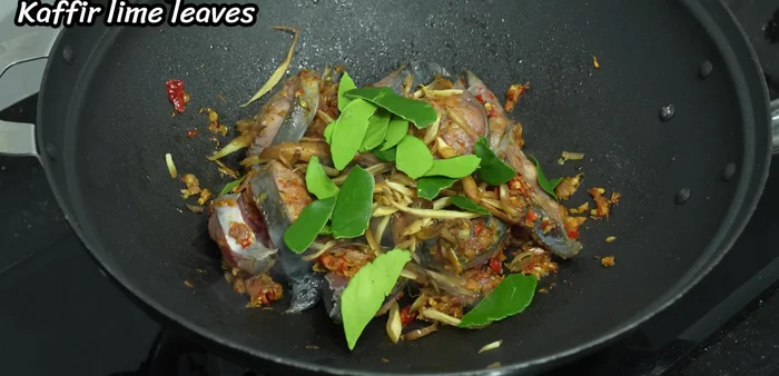 Stir-fry using high heat until the fish is cooked.