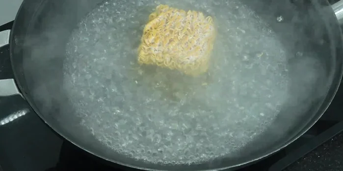 Cook instant noodles until slightly separated but not mushy. Drain and set aside.
