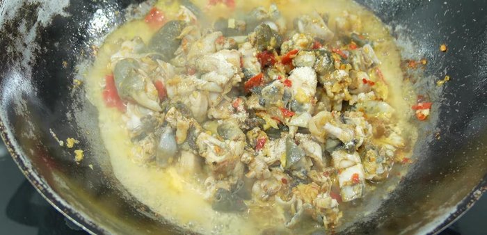 Add the sliced bell peppers and stir-fry until cooked.