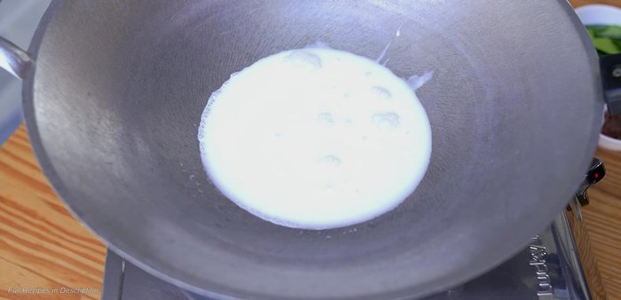 In the same pot, add coconut milk and bring to a simmer. (114.659)