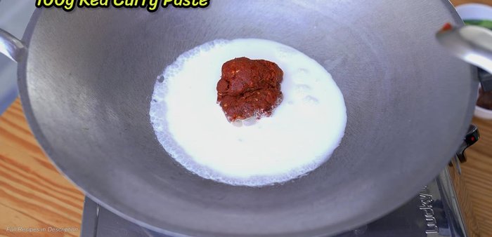 Add red curry paste and shrimp paste. Stir-fry until well combined. (146.76)
