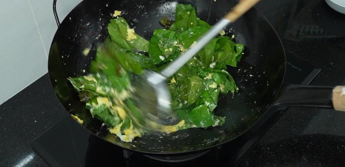 Stir-fry until the morning glory is cooked to your liking.
