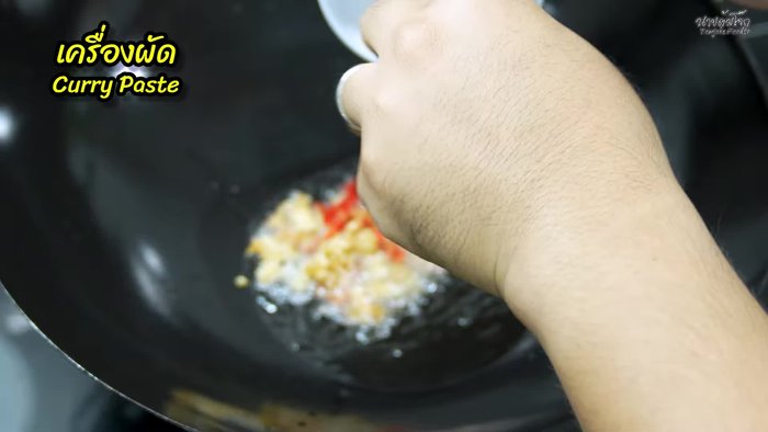 Add the chili, garlic, and pepper mixture to the hot oil and stir-fry until fragrant.
