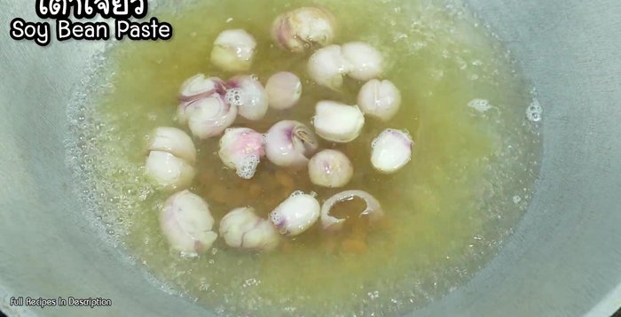 Add soybean paste, sugar, and tamarind juice to the boiling water.