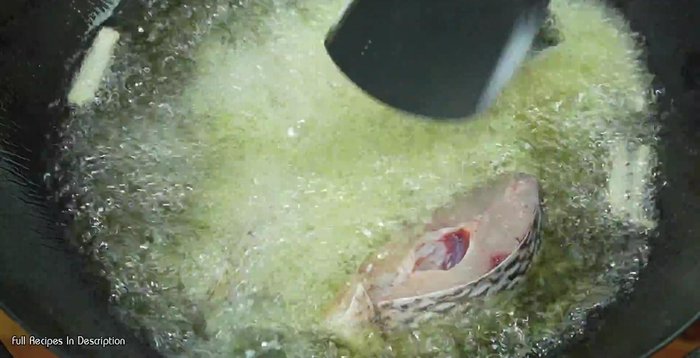 Fry the tilapia until crispy, frying one side at a time.