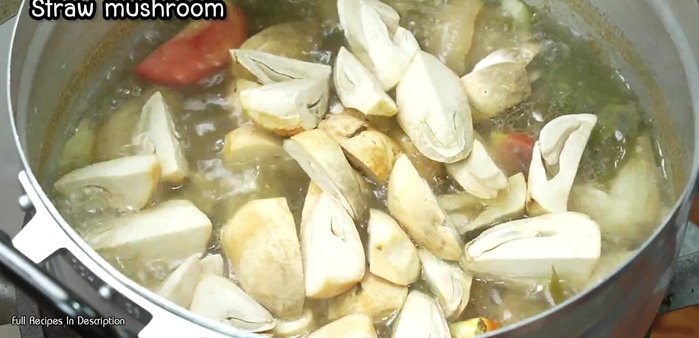 Add water, tomatoes, and straw mushrooms.