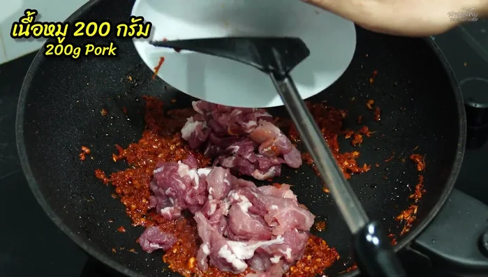 Add the pork and stir-fry until it starts to cook.