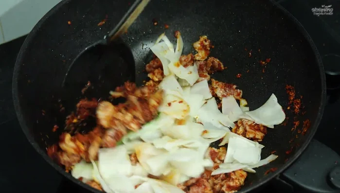 Stir-fry until everything is cooked through. Add a little water to help with seasoning.