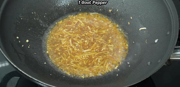 Add sliced chili peppers and stir-fry until fragrant and a sauce forms.